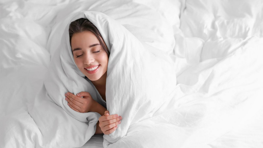Cozy woman in comforter